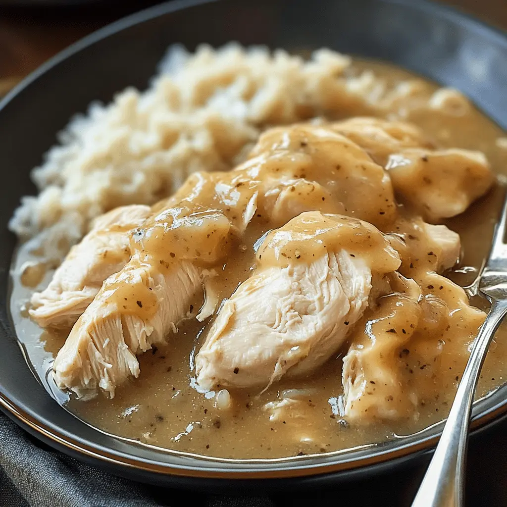 Warm up your dinner routine with this tender Slow Cooker Chicken and Gravy! This easy recipe features juicy chicken smothered in a rich, flavorful gravy that's perfect over rice or mashed potatoes. Ideal for busy weeknights or cozy family gatherings. Save this pin for a comforting meal your loved ones will enjoy!