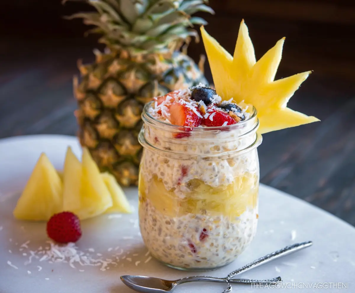 Creamy Piña Colada Overnight Oats topped with pineapple chunks and shredded coconut for a tropical breakfast.