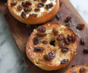 Delicious 5-ingredient cinnamon raisin Greek yogurt bagels on a wooden surface