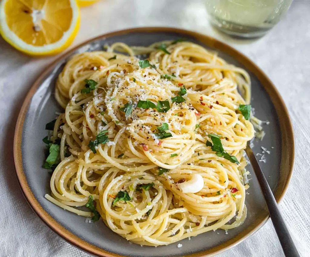 Delicious lemon butter garlic pasta garnished with fresh herbs, perfect for a quick dinner.