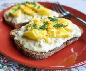 Creamed eggs on toasted bread with a creamy, savory sauce perfect for breakfast or brunch.